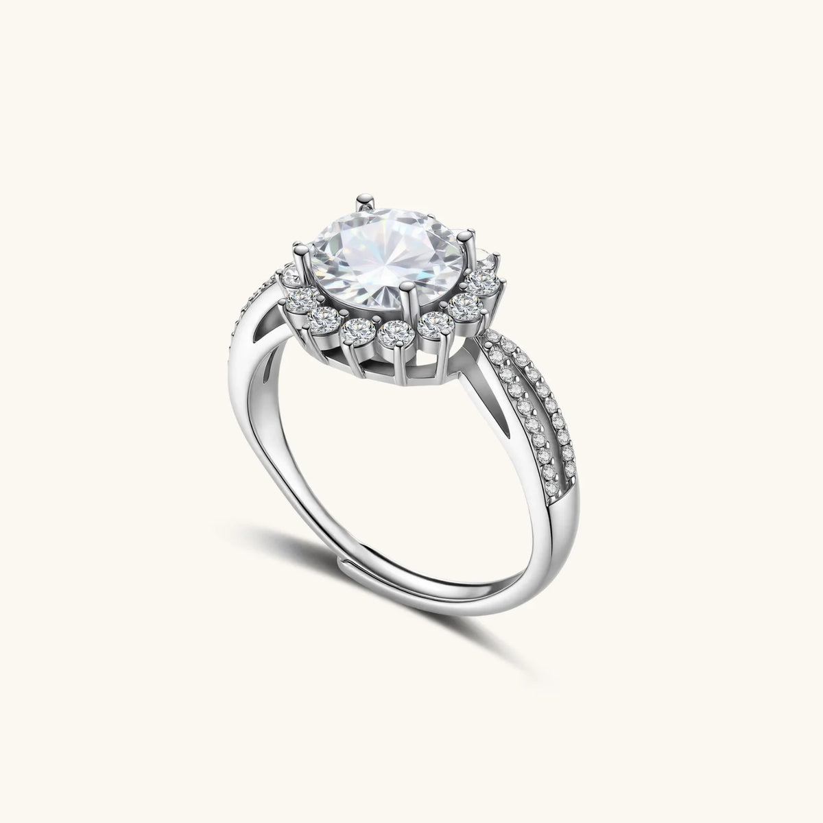 close-up of sterling silver halo ring with brilliant round moissanite center stone surrounded by smaller accent stones