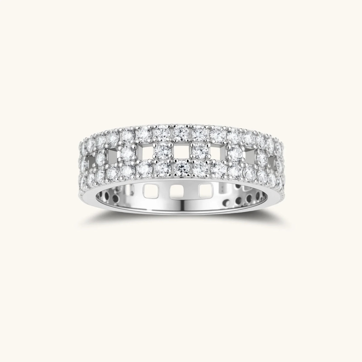 wide sterling silver ring with three rows of brilliant moissanite stones in geometric pavé setting on white background