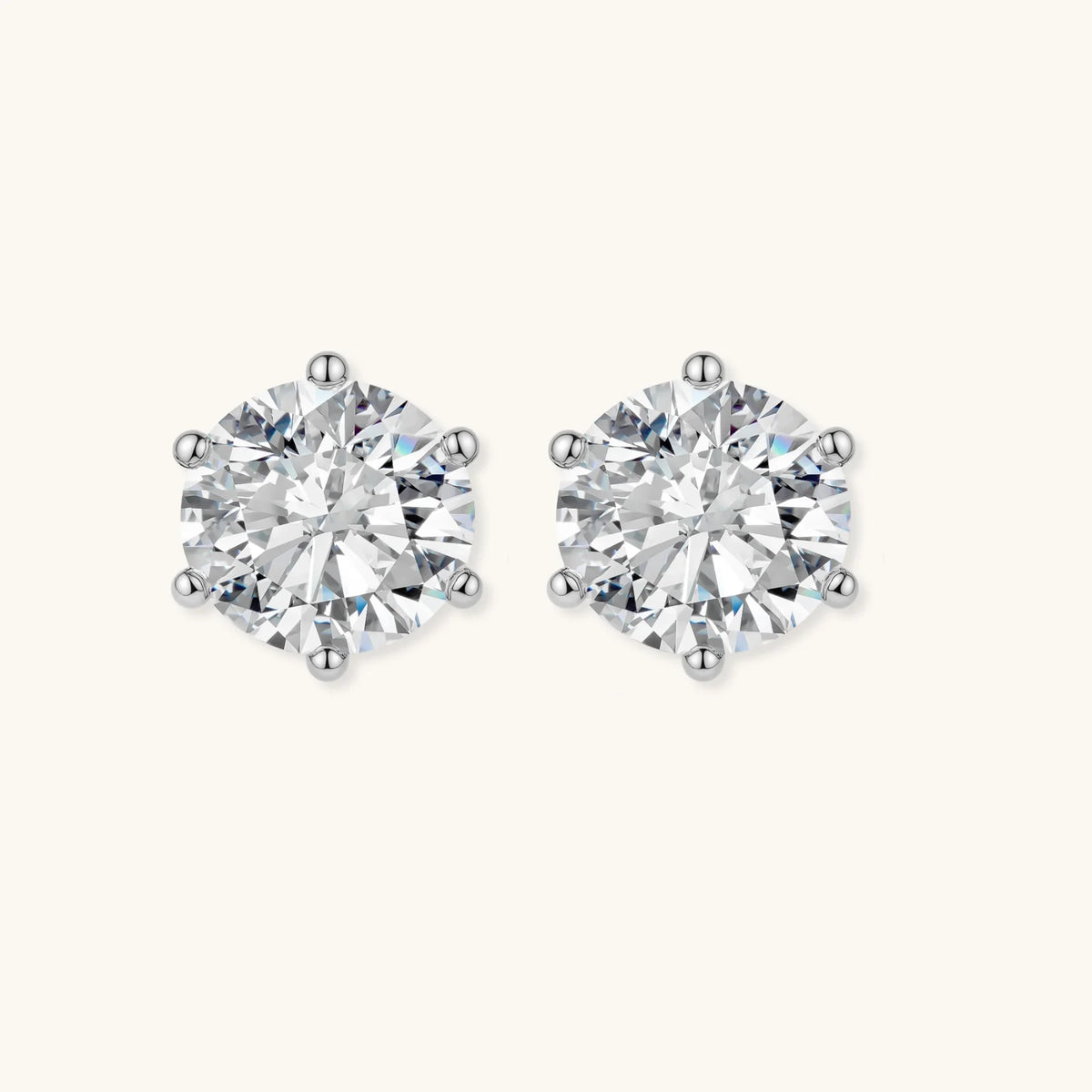 close-up of round brilliant-cut moissanite stud earrings in 6-prong sterling silver settings showing exceptional sparkle
