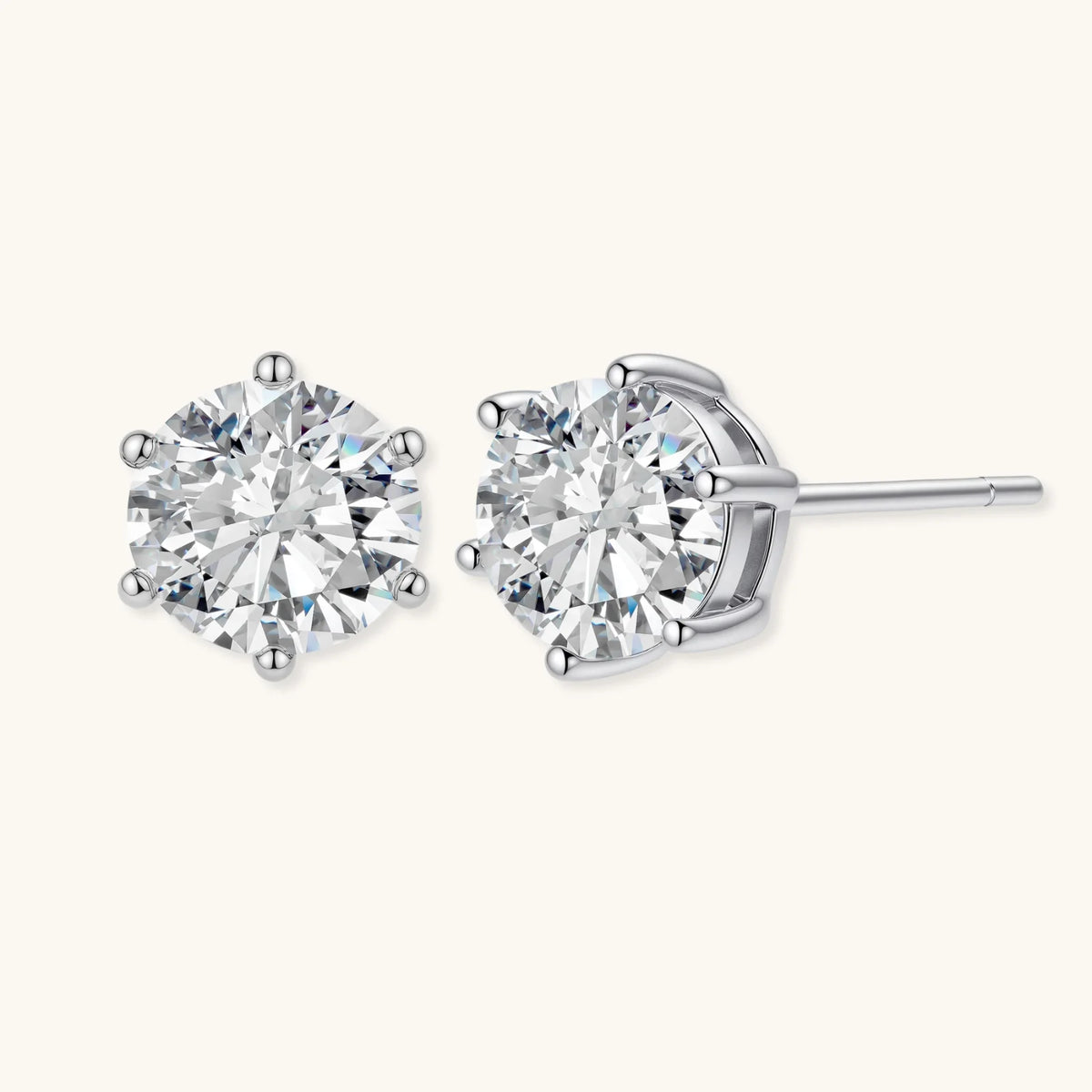 close-up of round brilliant-cut moissanite stud earrings in 6-prong sterling silver settings showing exceptional sparkle