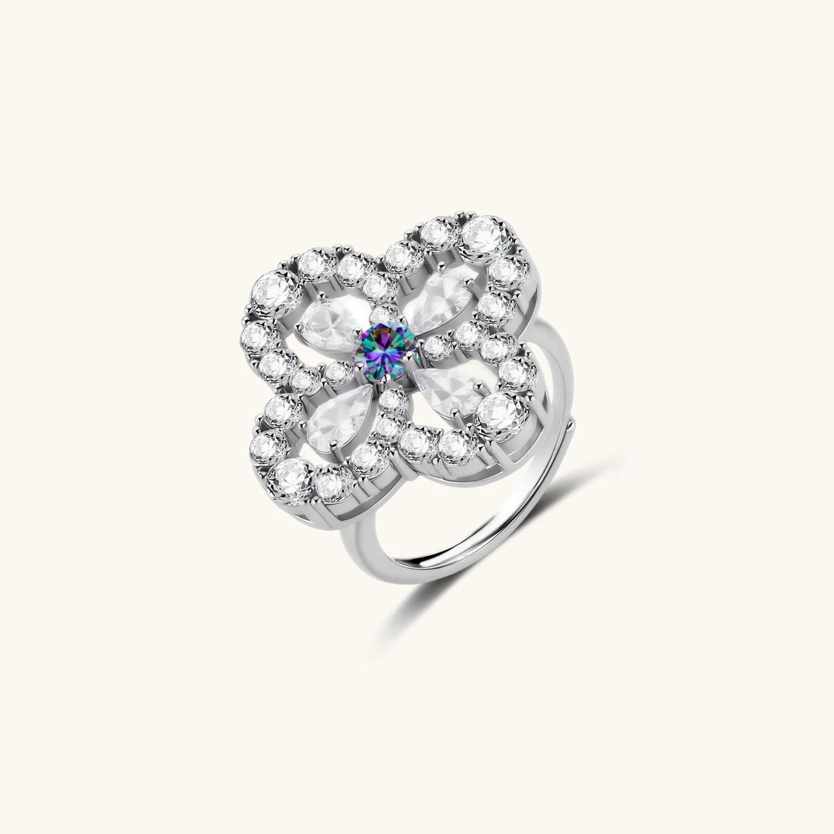 flower-shaped sterling silver ring with brilliant round moissanite center stone and crystal petals on neutral background