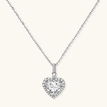 Complete jewelry set with heart-shaped sterling silver pieces featuring brilliant moissanite stones on white background.