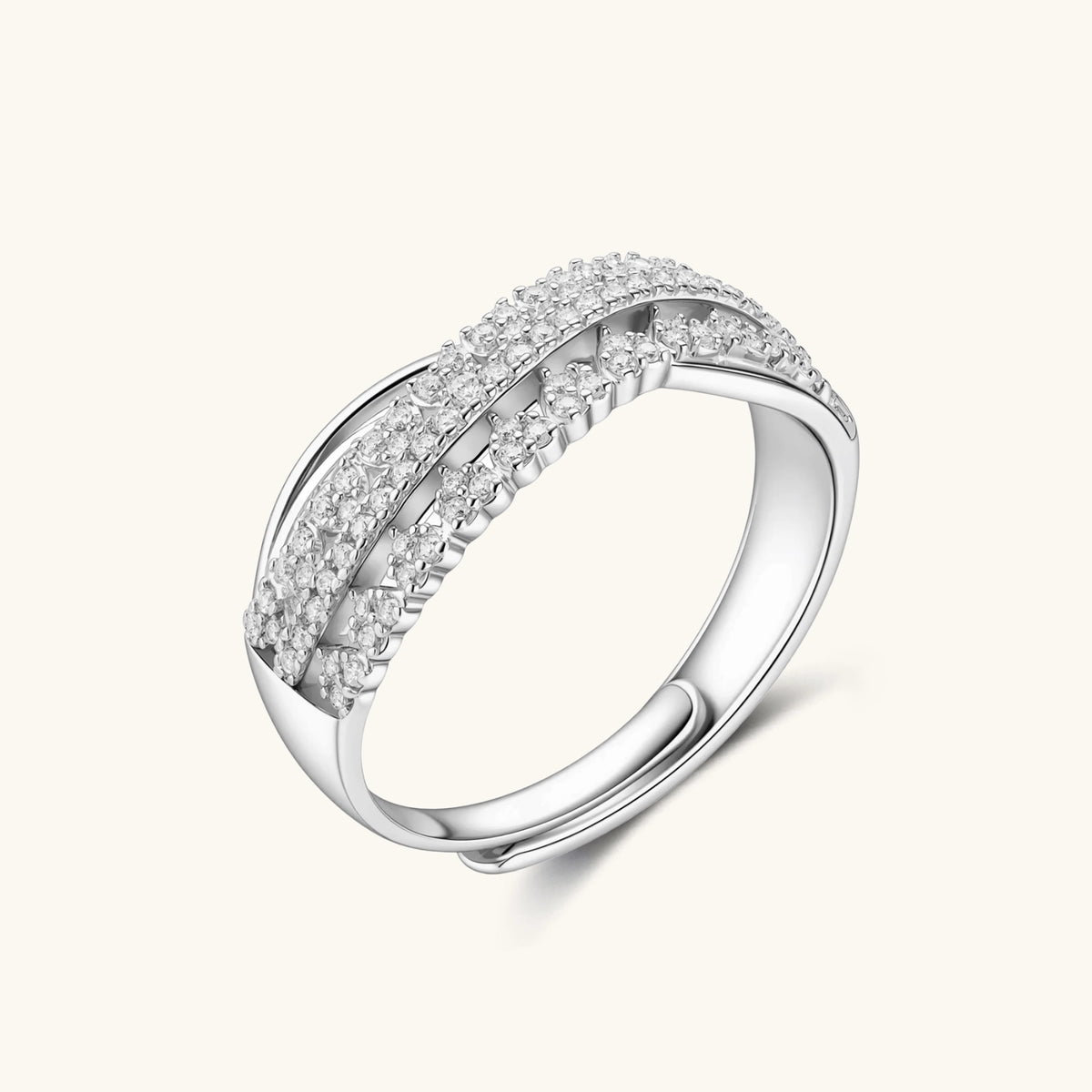 sterling silver crossover ring with pavé-set moissanite stones creating an elegant infinity design on neutral background