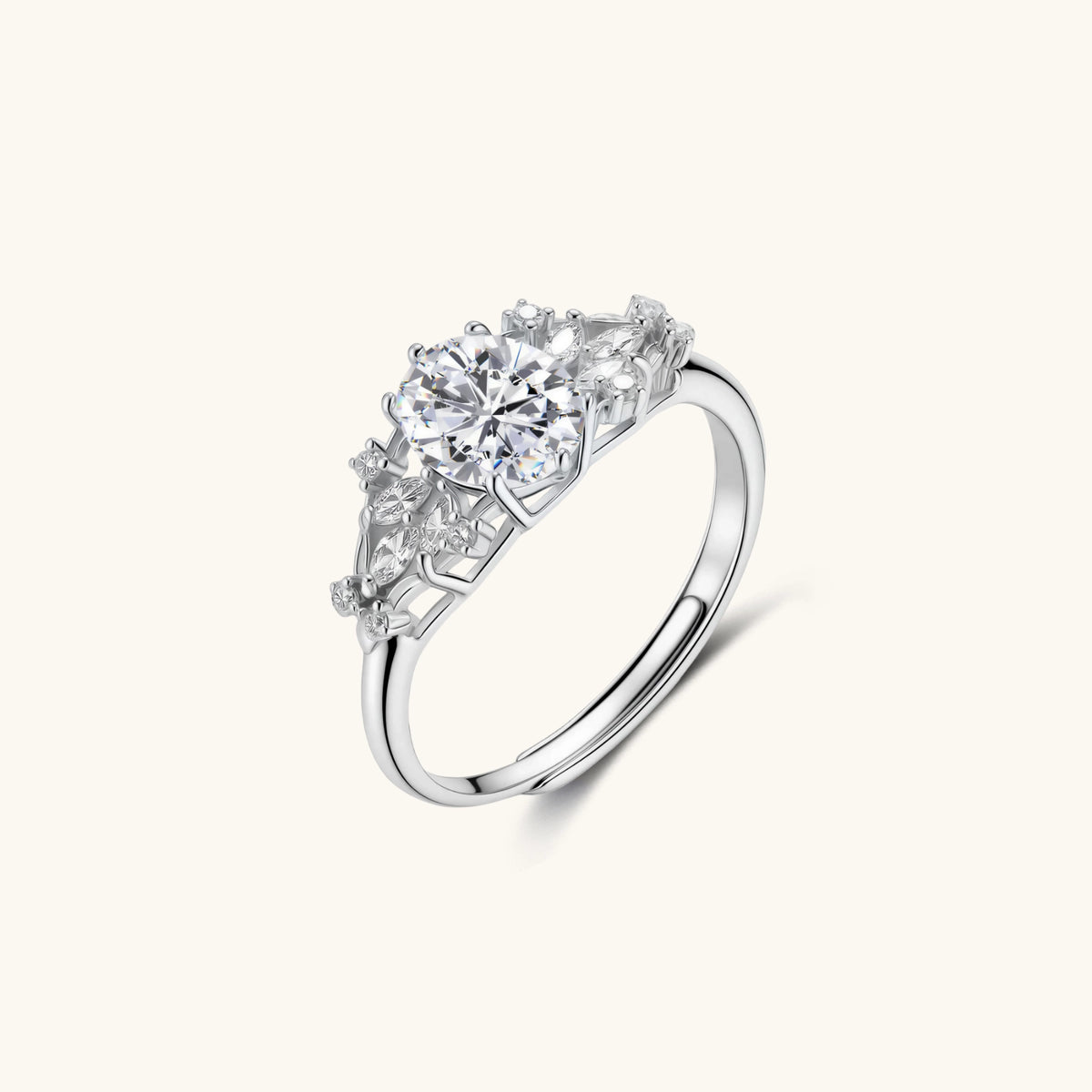 sterling silver ring with oval moissanite center stone surrounded by smaller accent stones in ornate setting