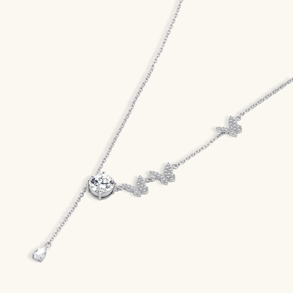 sterling silver y-shaped necklace with butterfly charms and brilliant moissanite stone with teardrop pendant
