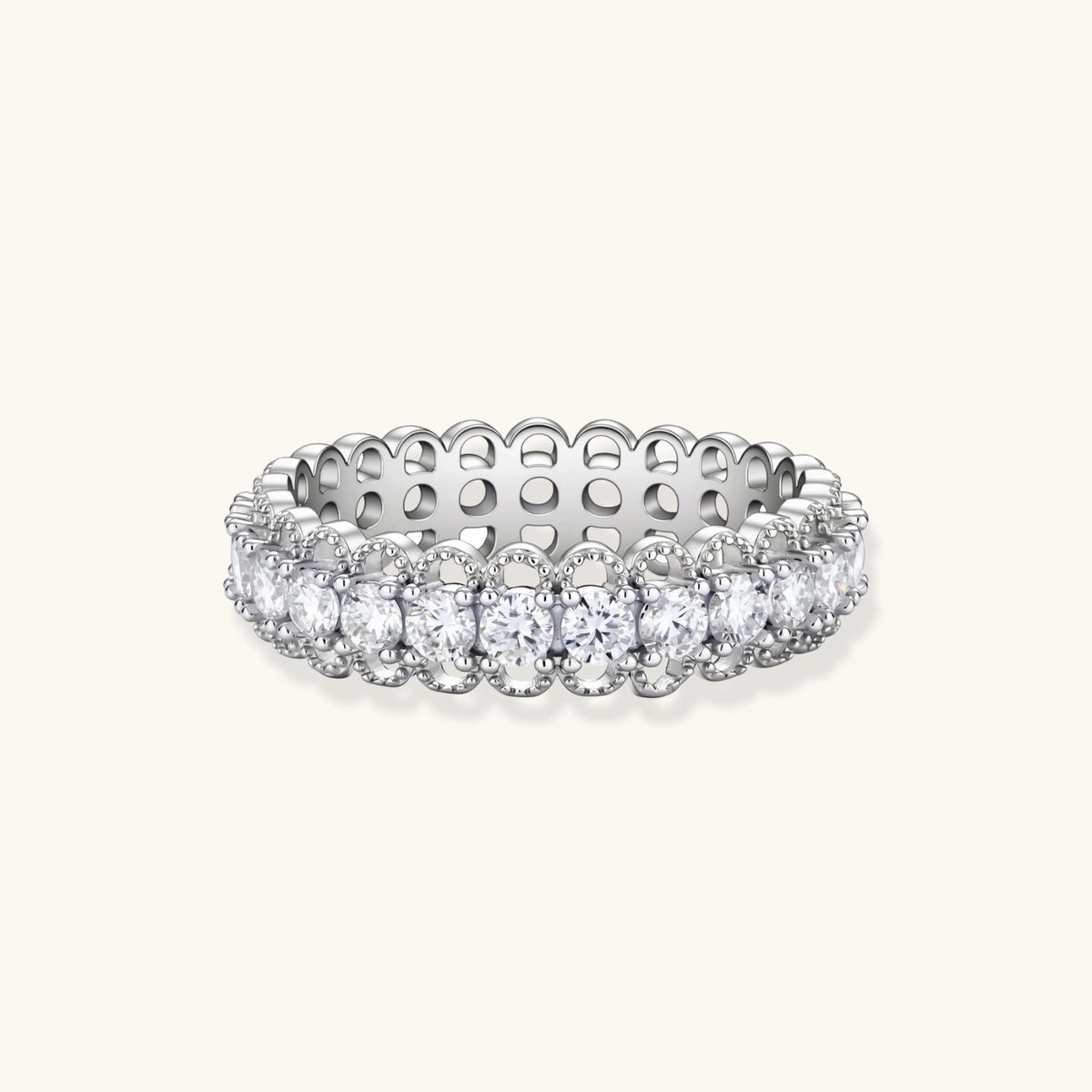 sterling silver eternity ring with continuous row of brilliant moissanite stones in scalloped crown setting with milgrain detail