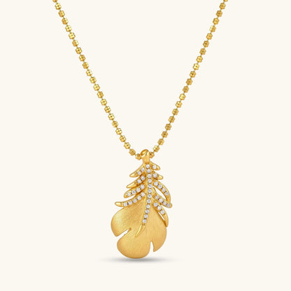 18K gold-plated 925 silver leaf pendant with brushed finish and cubic zirconia accents on a beaded ball chain.