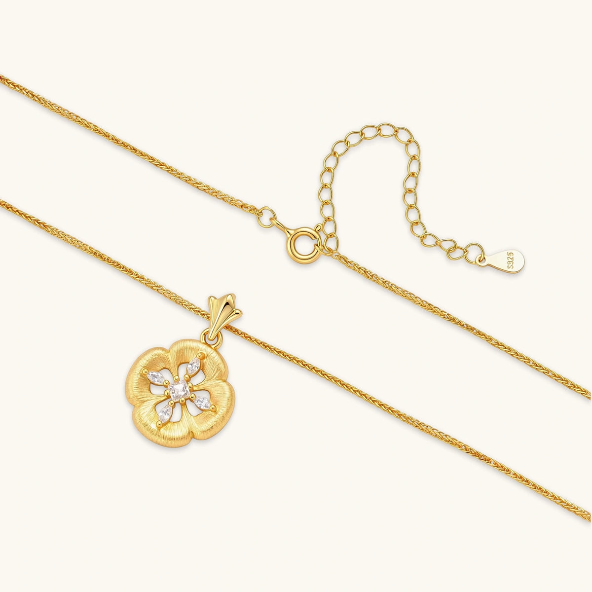 gold-plated flower pendant necklace with brushed finish, open-work center, marquise cz stones on wheat chain, s925 stamp.