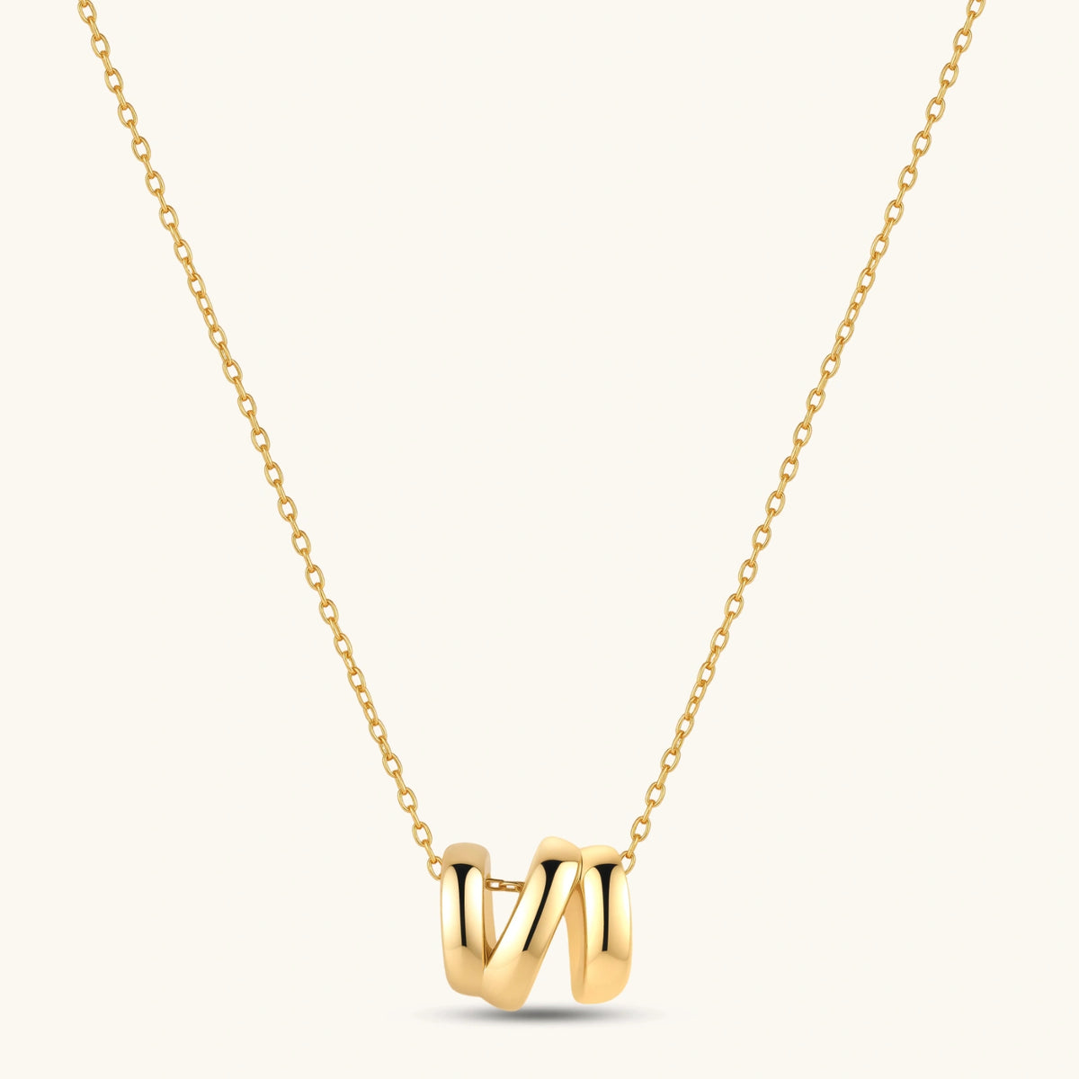18K gold-plated 925 sterling silver letter N pendant on a delicate adjustable cable chain, cream background.