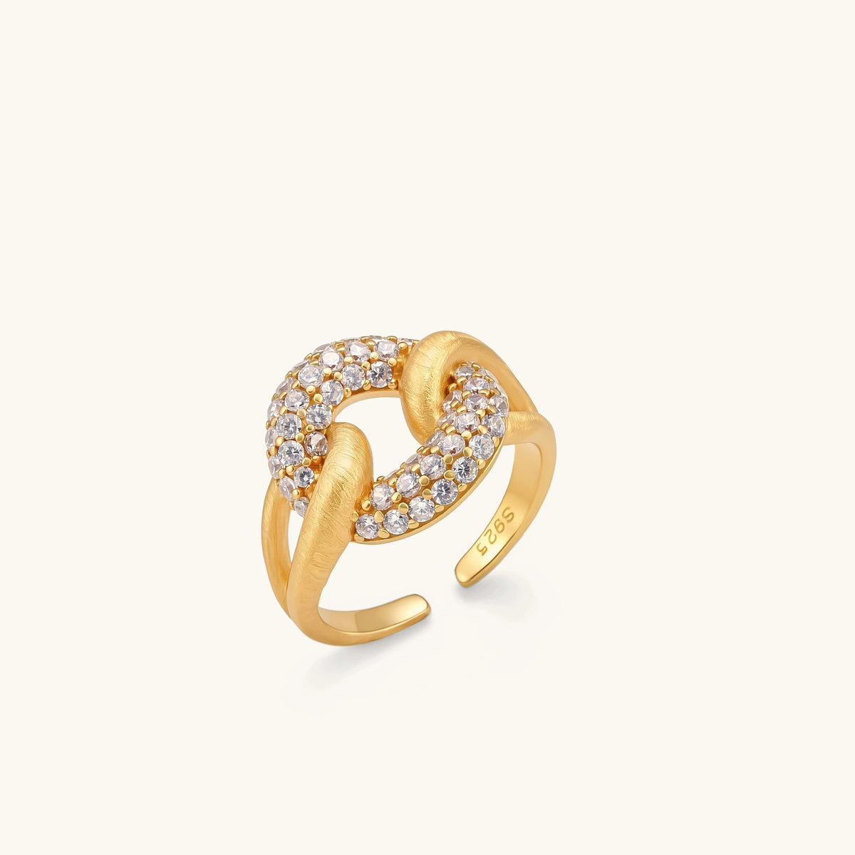 adjustable 18k gold-plated open cuff ring with interlocking chain links, one brushed gold, one pavé-set cubic zirconia. s925 stamped.